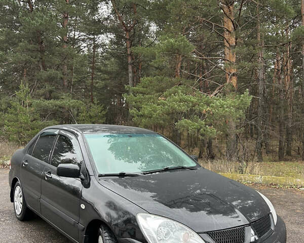 Черный Мицубиси Лансер, объемом двигателя 1.58 л и пробегом 254 тыс. км за 5000 $, фото 6 на Automoto.ua