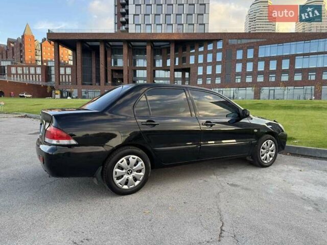 Черный Мицубиси Лансер, объемом двигателя 1.58 л и пробегом 237 тыс. км за 3999 $, фото 14 на Automoto.ua