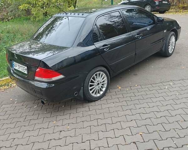 Чорний Міцубісі Lancer, об'ємом двигуна 1.58 л та пробігом 190 тис. км за 3750 $, фото 21 на Automoto.ua