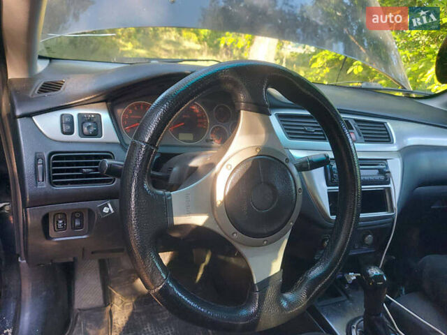 Чорний Міцубісі Lancer, об'ємом двигуна 2 л та пробігом 290 тис. км за 3300 $, фото 8 на Automoto.ua
