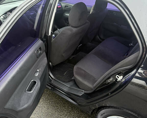 Чорний Міцубісі Lancer, об'ємом двигуна 1.58 л та пробігом 256 тис. км за 3700 $, фото 17 на Automoto.ua