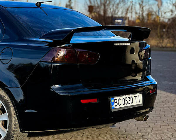 Черный Мицубиси Лансер, объемом двигателя 2 л и пробегом 333 тыс. км за 7300 $, фото 3 на Automoto.ua