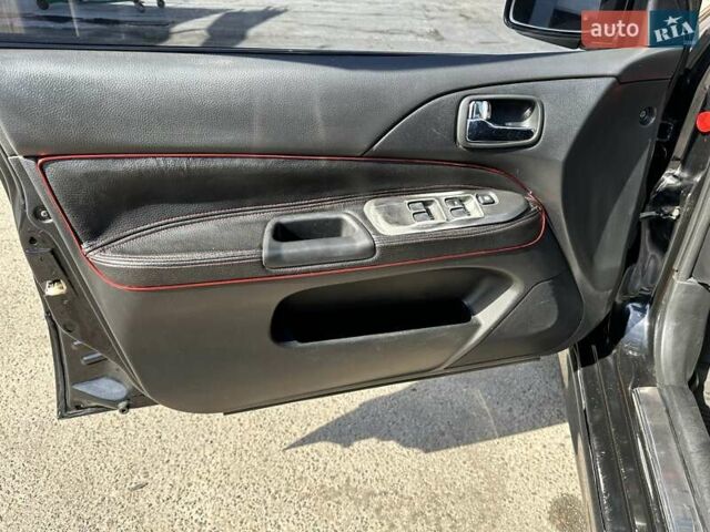 Черный Мицубиси Лансер, объемом двигателя 2 л и пробегом 272 тыс. км за 5514 $, фото 14 на Automoto.ua