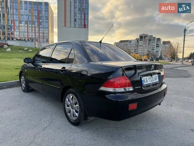 Черный Мицубиси Лансер, объемом двигателя 1.58 л и пробегом 237 тыс. км за 3950 $, фото 5 на Automoto.ua