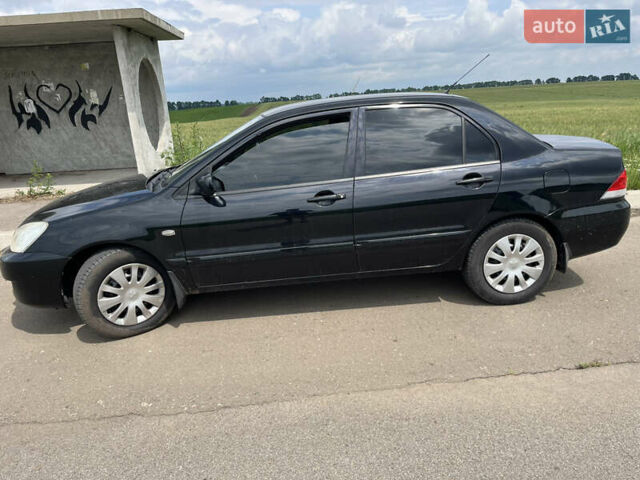 Черный Мицубиси Лансер, объемом двигателя 1.59 л и пробегом 150 тыс. км за 5500 $, фото 7 на Automoto.ua