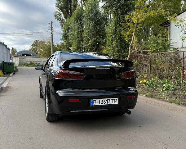 Черный Мицубиси Лансер, объемом двигателя 2 л и пробегом 219 тыс. км за 6400 $, фото 4 на Automoto.ua