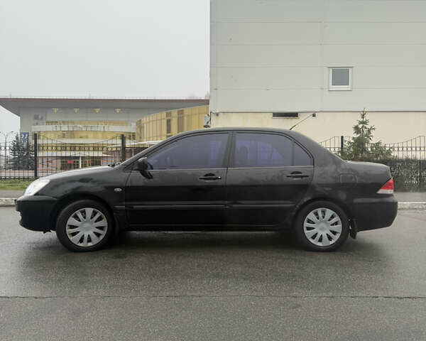 Чорний Міцубісі Lancer, об'ємом двигуна 1.58 л та пробігом 256 тис. км за 3700 $, фото 2 на Automoto.ua