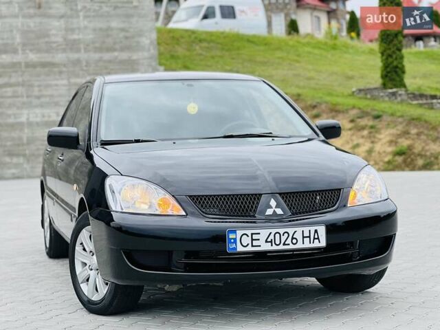 Чорний Міцубісі Lancer, об'ємом двигуна 1.6 л та пробігом 243 тис. км за 4950 $, фото 18 на Automoto.ua