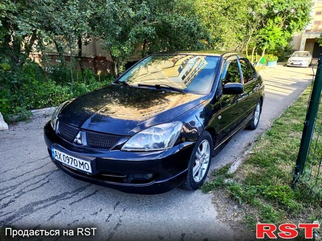 Черный Мицубиси Лансер, объемом двигателя 2 л и пробегом 200 тыс. км за 4450 $, фото 3 на Automoto.ua