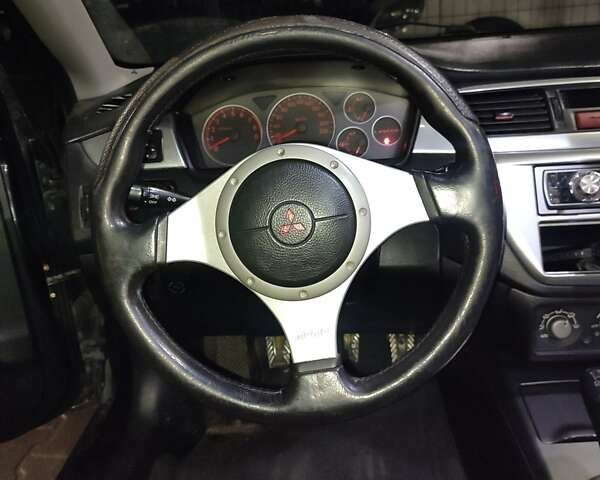 Чорний Міцубісі Lancer, об'ємом двигуна 2 л та пробігом 145 тис. км за 5000 $, фото 4 на Automoto.ua