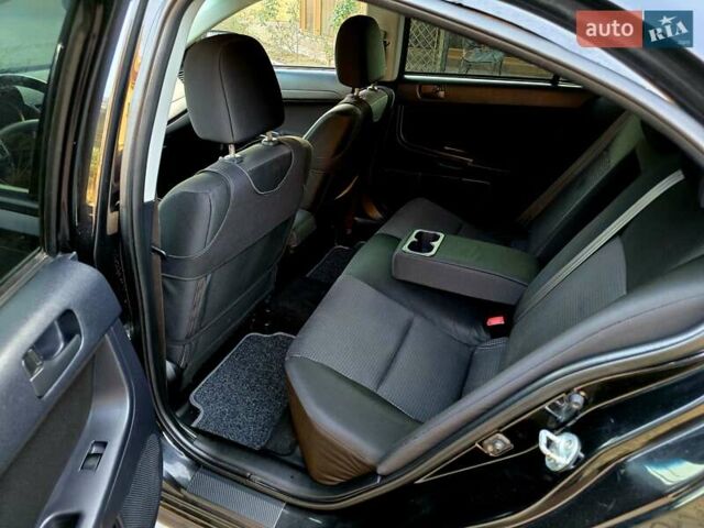 Чорний Міцубісі Lancer, об'ємом двигуна 2 л та пробігом 260 тис. км за 6555 $, фото 28 на Automoto.ua