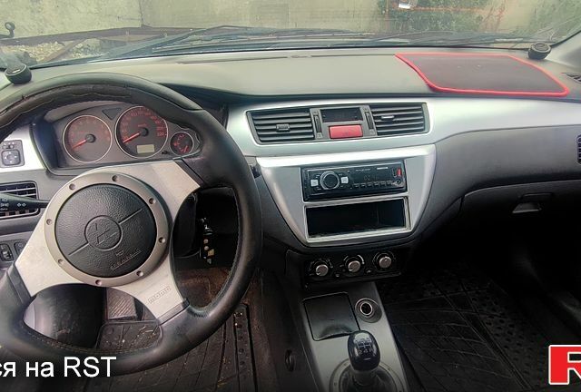 Чорний Міцубісі Lancer, об'ємом двигуна 2 л та пробігом 200 тис. км за 1800 $, фото 1 на Automoto.ua