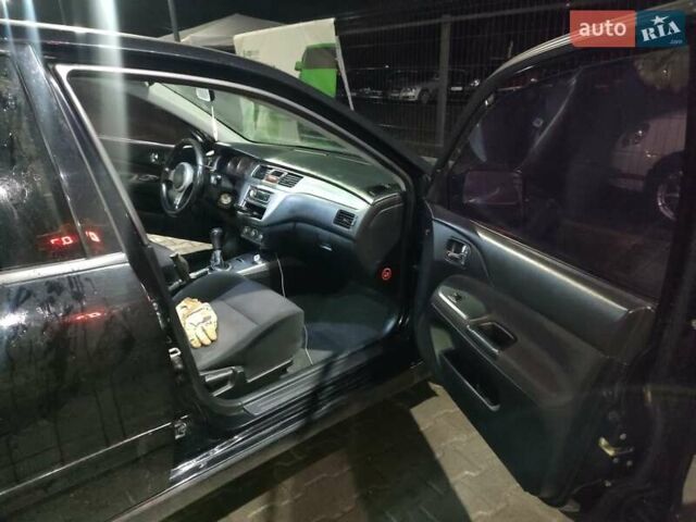 Чорний Міцубісі Lancer, об'ємом двигуна 2 л та пробігом 145 тис. км за 5000 $, фото 9 на Automoto.ua