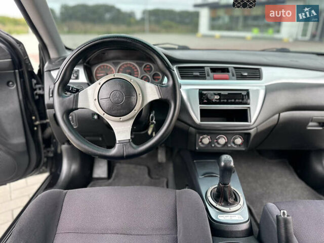 Чорний Міцубісі Lancer, об'ємом двигуна 2 л та пробігом 275 тис. км за 5300 $, фото 42 на Automoto.ua
