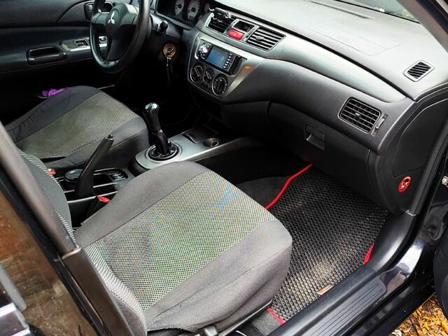 Черный Мицубиси Лансер, объемом двигателя 1.6 л и пробегом 171 тыс. км за 4350 $, фото 8 на Automoto.ua