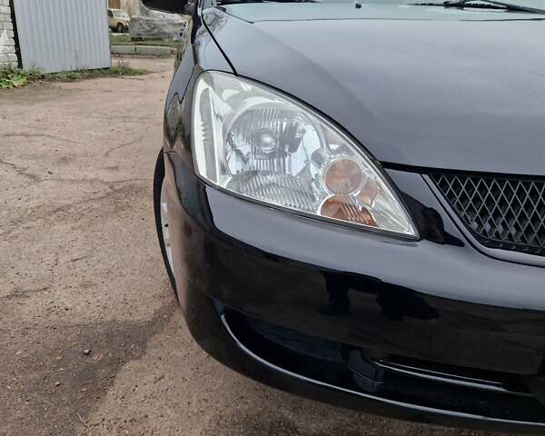 Чорний Міцубісі Lancer, об'ємом двигуна 1.6 л та пробігом 273 тис. км за 3999 $, фото 10 на Automoto.ua