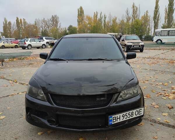 Мицубиси Лансер 2007 в Южноукраинске на Automoto.ua Черный Мицубиси Лансер, объемом двигателя 2 л и пробегом 161 тыс. км за 4600 $, фото 1 на Automoto.ua