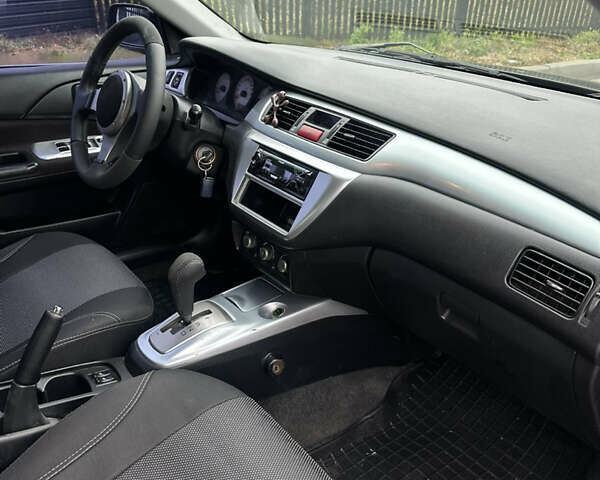 Черный Мицубиси Лансер, объемом двигателя 2 л и пробегом 260 тыс. км за 5300 $, фото 9 на Automoto.ua