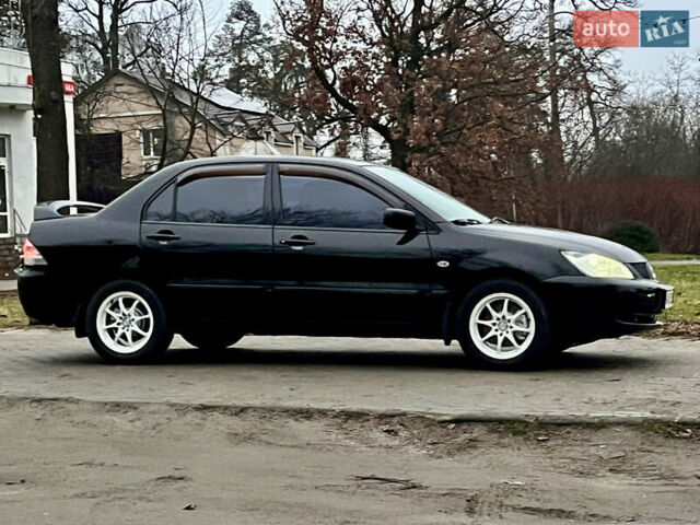 Чорний Міцубісі Lancer, об'ємом двигуна 1.6 л та пробігом 303 тис. км за 4350 $, фото 2 на Automoto.ua