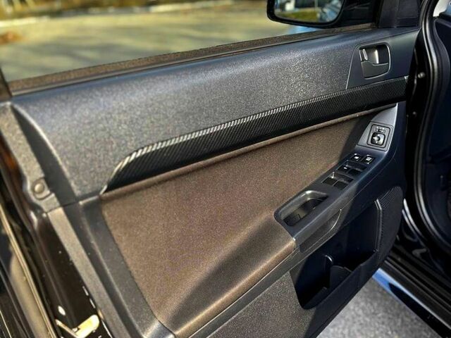 Черный Мицубиси Лансер, объемом двигателя 2 л и пробегом 224 тыс. км за 7000 $, фото 5 на Automoto.ua