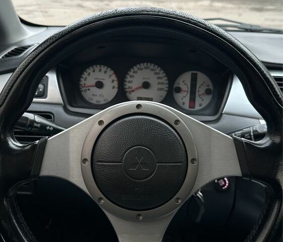 Чорний Міцубісі Lancer, об'ємом двигуна 2 л та пробігом 143 тис. км за 5400 $, фото 7 на Automoto.ua