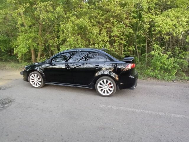 Черный Мицубиси Лансер, объемом двигателя 2 л и пробегом 245 тыс. км за 7500 $, фото 2 на Automoto.ua