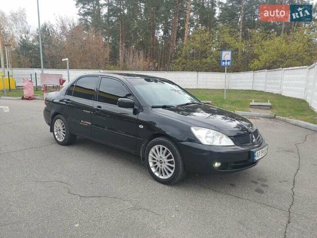 Чорний Міцубісі Lancer, об'ємом двигуна 1.58 л та пробігом 190 тис. км за 3750 $, фото 9 на Automoto.ua