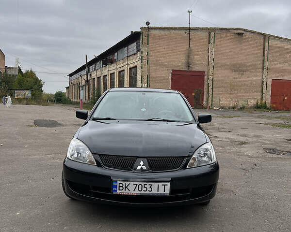 Чорний Міцубісі Lancer, об'ємом двигуна 1.58 л та пробігом 256 тис. км за 4200 $, фото 2 на Automoto.ua