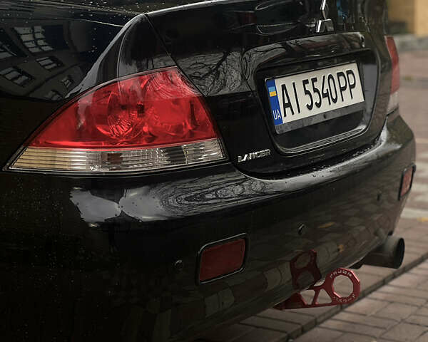 Черный Мицубиси Лансер, объемом двигателя 1.6 л и пробегом 211 тыс. км за 5700 $, фото 42 на Automoto.ua