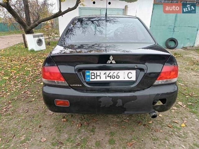 Чорний Міцубісі Lancer, об'ємом двигуна 1.58 л та пробігом 227 тис. км за 4100 $, фото 2 на Automoto.ua