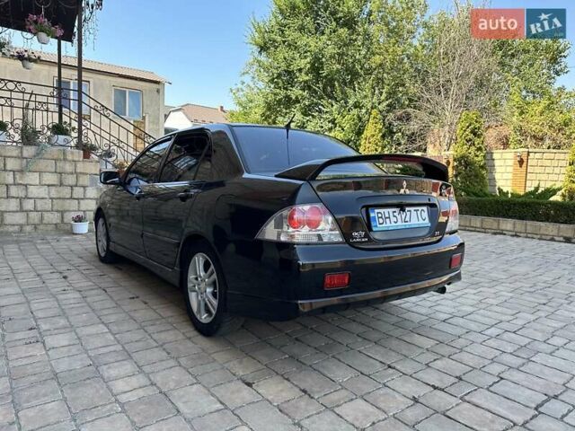 Черный Мицубиси Лансер, объемом двигателя 2 л и пробегом 272 тыс. км за 5514 $, фото 3 на Automoto.ua