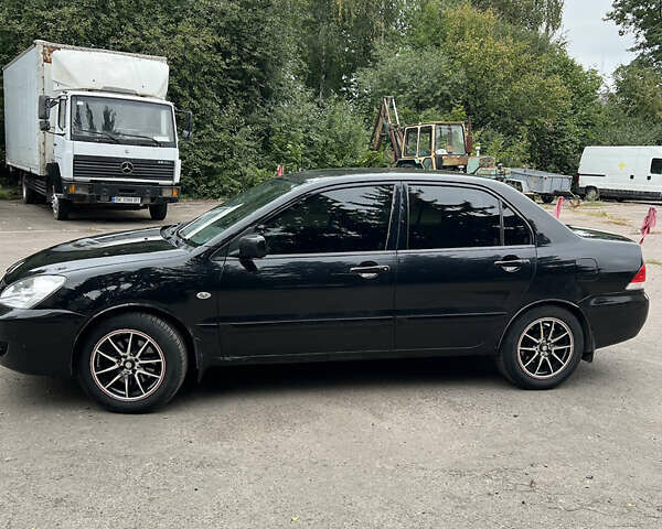 Чорний Міцубісі Lancer, об'ємом двигуна 1.58 л та пробігом 256 тис. км за 4200 $, фото 3 на Automoto.ua