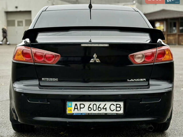 Черный Мицубиси Лансер, объемом двигателя 2 л и пробегом 215 тыс. км за 5500 $, фото 8 на Automoto.ua