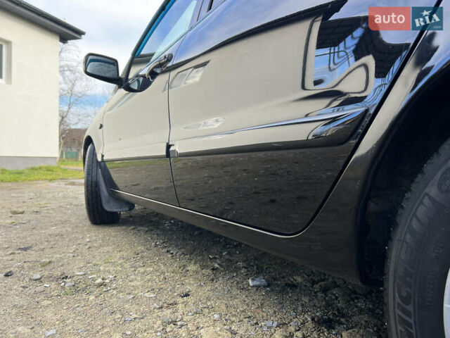 Чорний Міцубісі Lancer, об'ємом двигуна 1.58 л та пробігом 185 тис. км за 3750 $, фото 7 на Automoto.ua