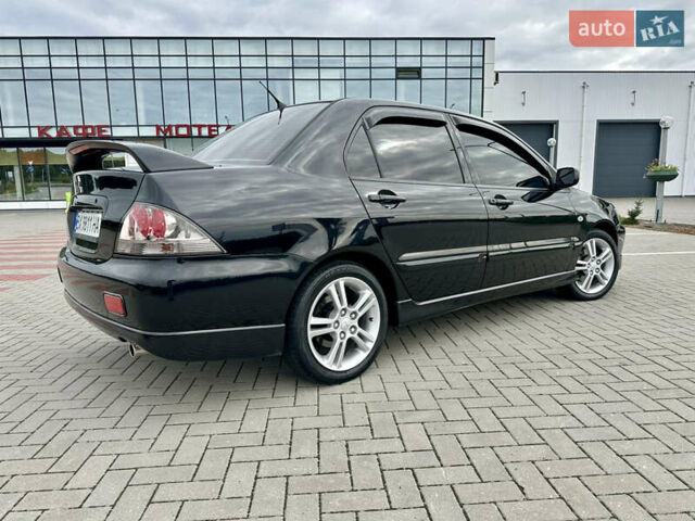 Чорний Міцубісі Lancer, об'ємом двигуна 2 л та пробігом 275 тис. км за 5300 $, фото 10 на Automoto.ua