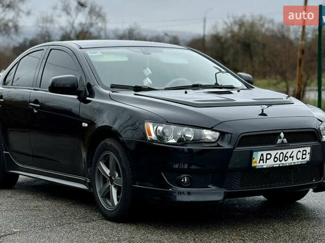 Черный Мицубиси Лансер, объемом двигателя 2 л и пробегом 215 тыс. км за 5500 $, фото 5 на Automoto.ua