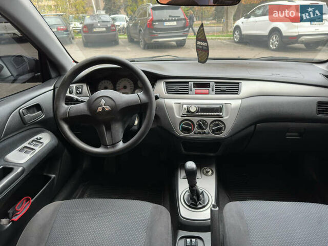 Чорний Міцубісі Lancer, об'ємом двигуна 1.58 л та пробігом 173 тис. км за 4700 $, фото 13 на Automoto.ua