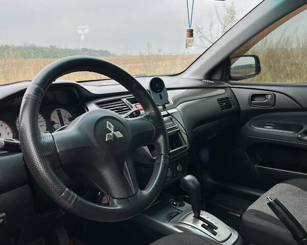 Чорний Міцубісі Lancer, об'ємом двигуна 1.6 л та пробігом 212 тис. км за 4700 $, фото 8 на Automoto.ua