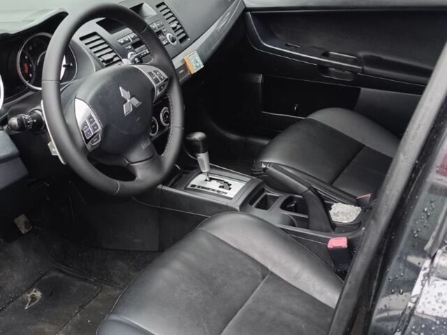 Черный Мицубиси Лансер, объемом двигателя 2 л и пробегом 210 тыс. км за 6000 $, фото 9 на Automoto.ua