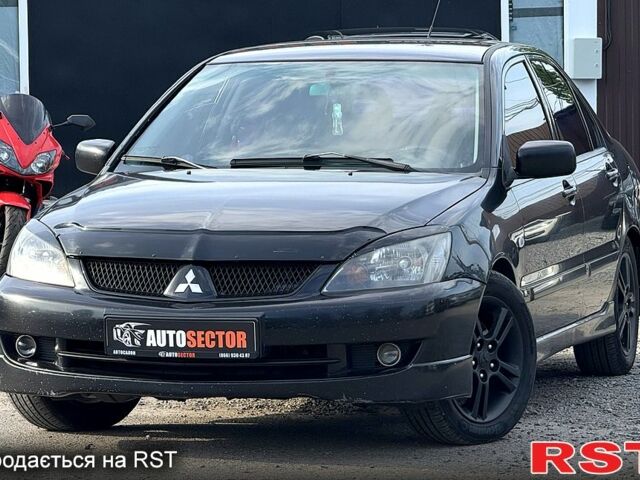 Черный Мицубиси Лансер, объемом двигателя 1.6 л и пробегом 260 тыс. км за 3700 $, фото 1 на Automoto.ua