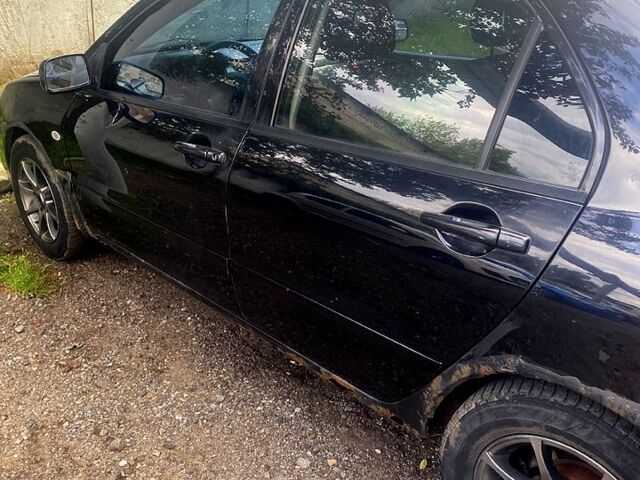 Чорний Міцубісі Lancer, об'ємом двигуна 1.6 л та пробігом 320 тис. км за 2500 $, фото 7 на Automoto.ua
