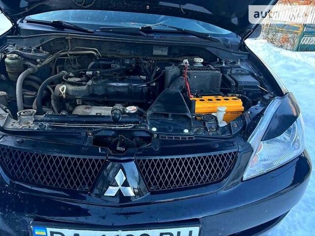 Чорний Міцубісі Lancer, об'ємом двигуна 1.6 л та пробігом 307 тис. км за 4000 $, фото 9 на Automoto.ua