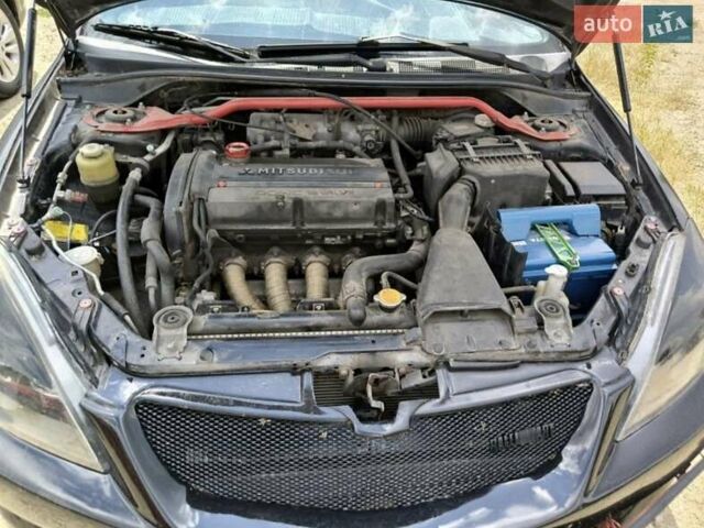 Чорний Міцубісі Lancer, об'ємом двигуна 2 л та пробігом 161 тис. км за 4300 $, фото 1 на Automoto.ua