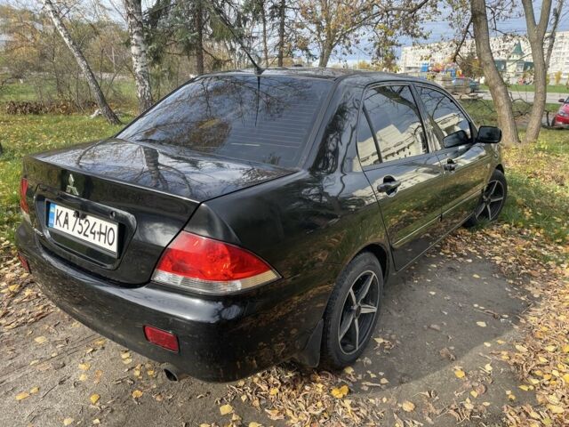 Міцубісі Lancer 2007 у Каневе на Automoto.ua Чорний Міцубісі Lancer, об'ємом двигуна 1.6 л та пробігом 310 тис. км за 4100 $, фото 2 на Automoto.ua