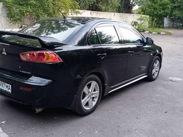 Черный Мицубиси Лансер, объемом двигателя 2 л и пробегом 210 тыс. км за 6000 $, фото 5 на Automoto.ua