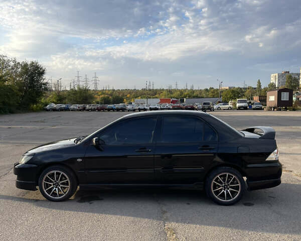 Чорний Міцубісі Lancer, об'ємом двигуна 2 л та пробігом 280 тис. км за 4600 $, фото 10 на Automoto.ua