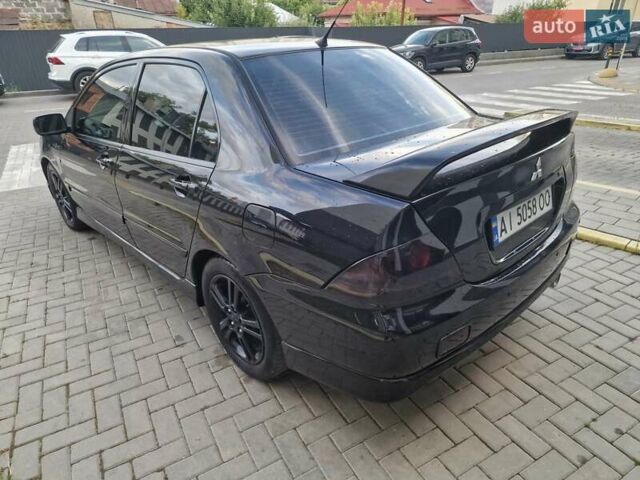 Чорний Міцубісі Lancer, об'ємом двигуна 2 л та пробігом 272 тис. км за 4750 $, фото 12 на Automoto.ua