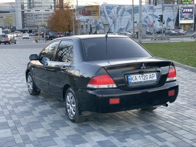 Черный Мицубиси Лансер, объемом двигателя 1.6 л и пробегом 237 тыс. км за 4300 $, фото 3 на Automoto.ua