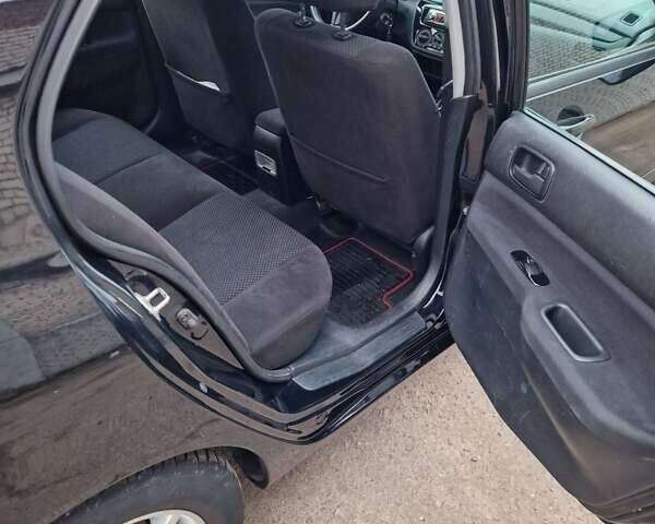 Чорний Міцубісі Lancer, об'ємом двигуна 1.6 л та пробігом 273 тис. км за 3999 $, фото 26 на Automoto.ua
