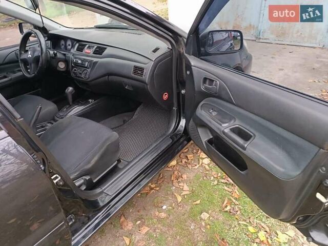 Чорний Міцубісі Lancer, об'ємом двигуна 1.58 л та пробігом 227 тис. км за 4100 $, фото 12 на Automoto.ua